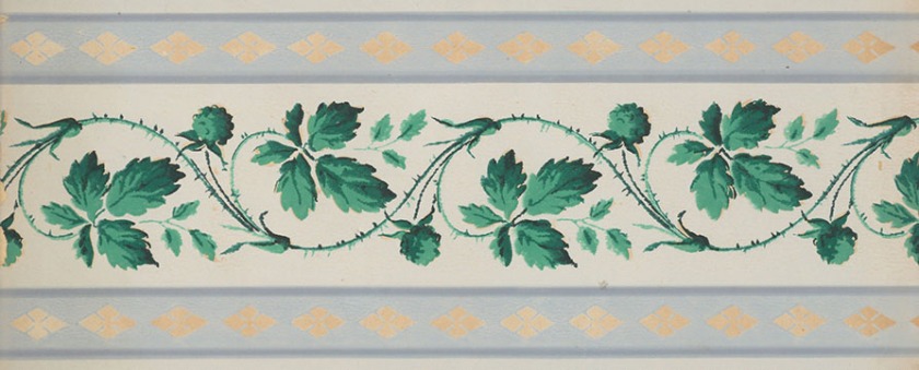 A vining pattern of green leaves and flowers.