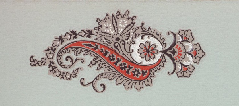 A red, white, and tan paisley on a green background.